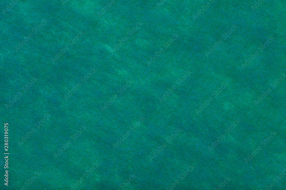Green background of felt fabric. Texture of woolen textile. Green background of felt fabric. Texture of woolen textile.