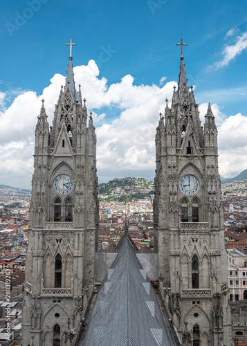 View of Basilica in Quito with city in background on cloudy day