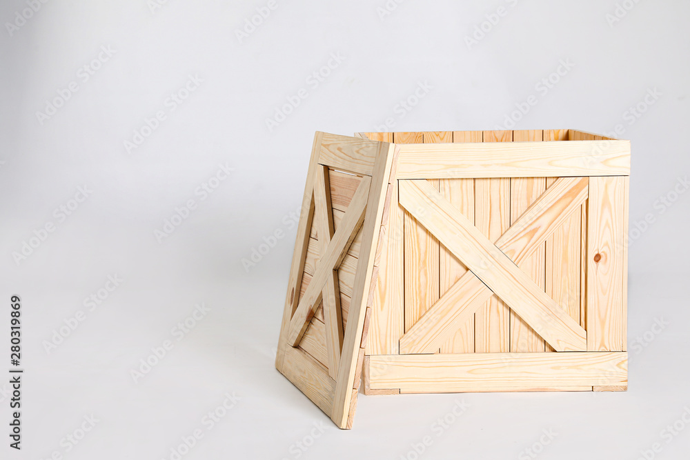 Open wooden crate on grey background. Space for text Open wooden crate on grey background. Space for text