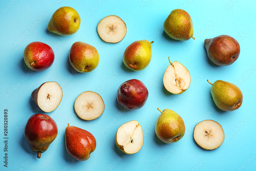 Ripe juicy pears on blue background, flat lay Ripe juicy pears on blue background, flat lay