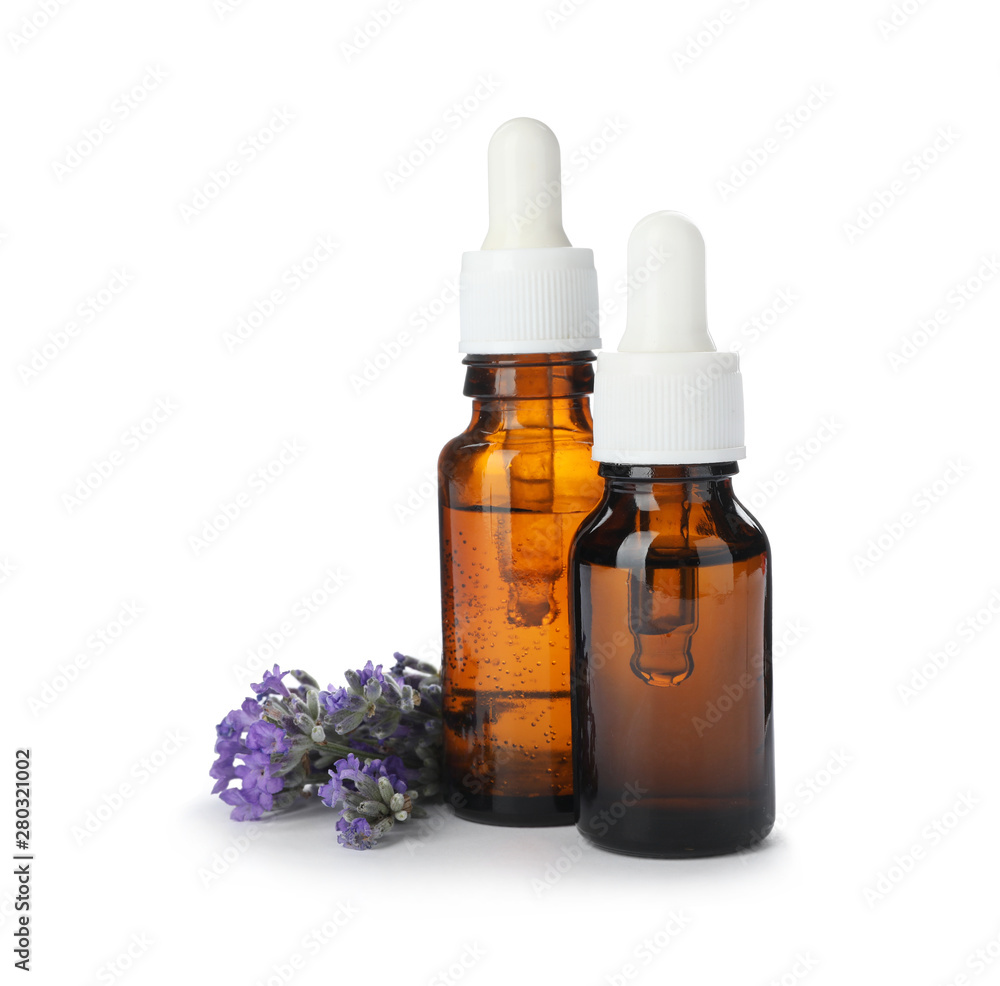 Bottles with natural lavender oil and flowers on white background Bottles with natural lavender oil and flowers on white background
