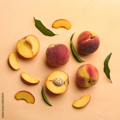 Flat lay composition with fresh peaches on beige background