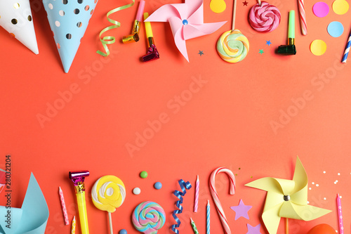 Flat lay composition with different birthday party items on coral background, space for text
