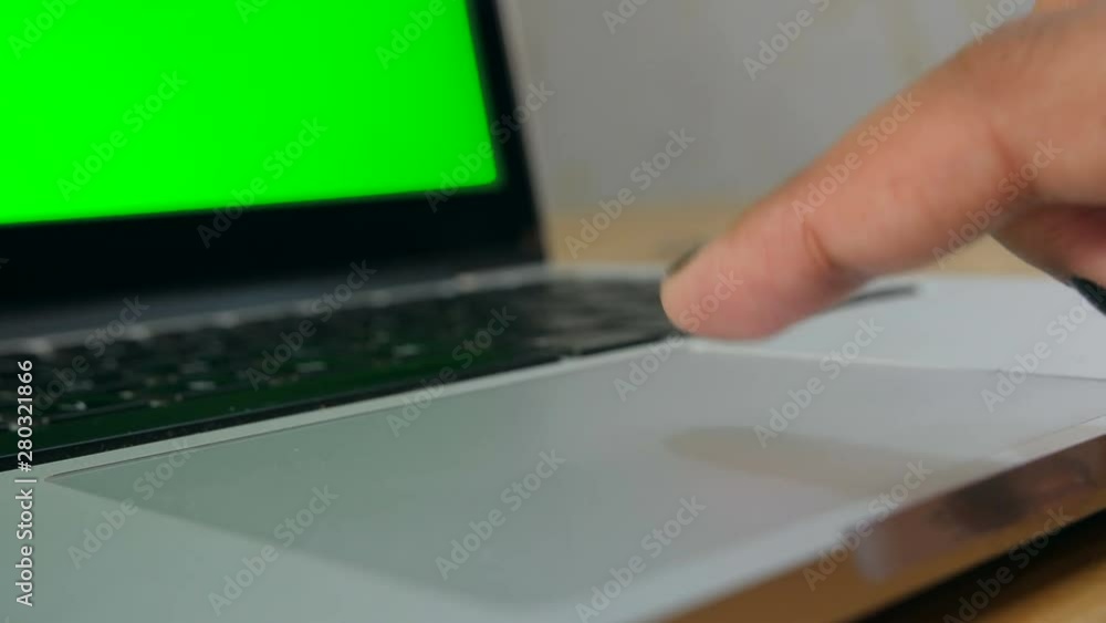 A girl moving her pointing cursor of a laptop's touchpad. Stock Video Adobe Stock