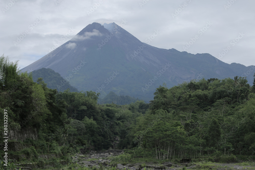 Mount Merapi, Gunung Merapi (literally Fire Mountain in Indonesian and Javanese), is an active stratovolcano located on the border between Central Java and Yogyakarta provinces, Indonesia Mount Merapi, Gunung Merapi (literally Fire Mountain in Indonesian and Javanese), is an active stratovolcano located on the border between Central Java and Yogyakarta provinces, Indonesia