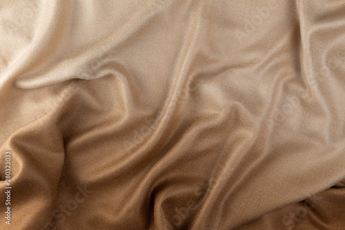 Luxurious fabric background. Texture of fabric. Fashion brown - beige gradient. Beautiful textiles design.
