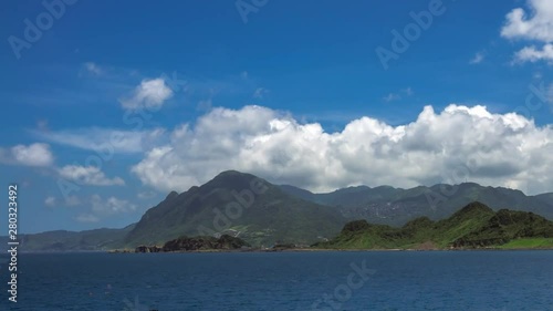 Wallpaper Mural Beautiful timelapse of green mountain and clouds in the tropical island of Taiwan. Beauty landscape with ocean and blue sky at Keelung. Scenic waterfront at sunny day of summer.-Dan Torontodigital.ca
