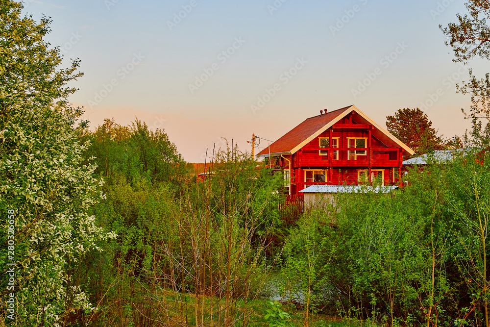 Tipical modern russian village with new house in a summer or spring day Tipical modern russian village with new house in a summer or spring day