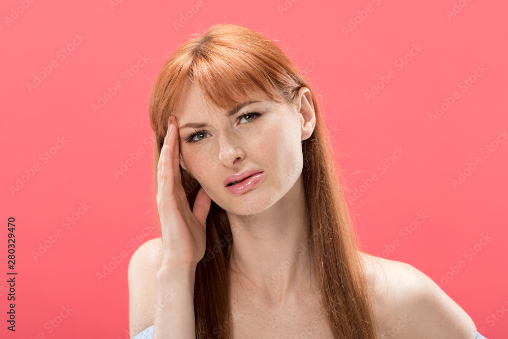 redhead young woman with headache touching head isolated on pink redhead young woman with headache touching head isolated on pink