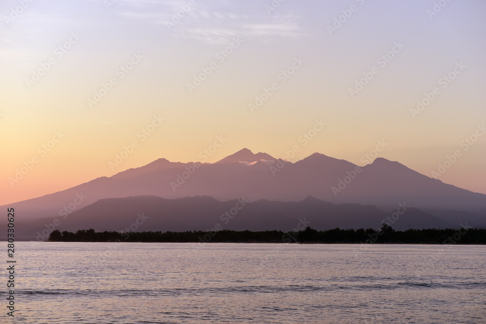 View of Gili Trawangan and Lombok Island from Gili Meno island in sunrise, Indonesia, Asia