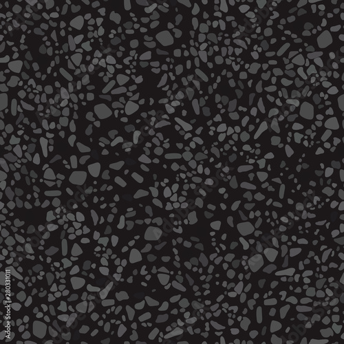 The black grainy texture of the asphalt.