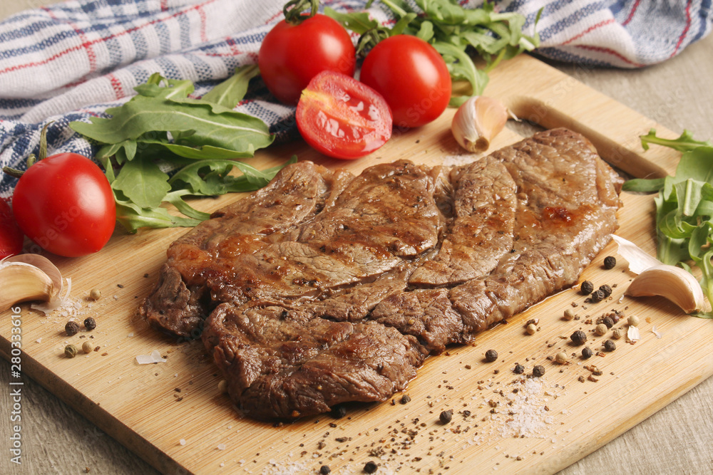 A beef steak well done with vegetables A beef steak well done with vegetables