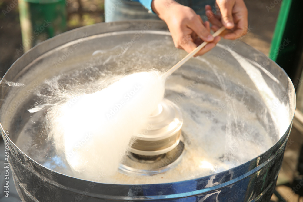 Making of sweet cotton candy outdoors