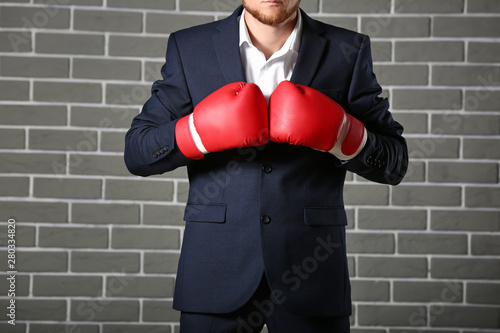 Businessman in boxing glove...