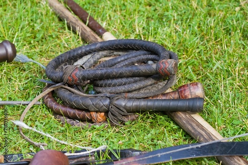 a set of Zaporozhian Sich cossack, kozak, popular arms, exact copies of ancient deathly weapons, lie on green grass
