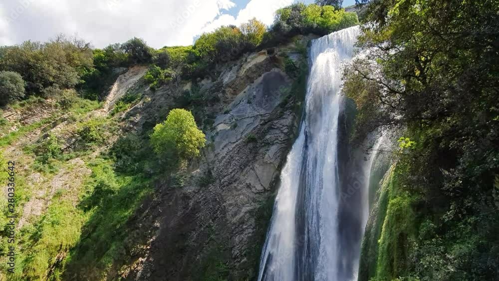 Beautiful big waterfall on a hot day in Italy. A drop of water in a wildlife Park. Beautiful big waterfall on a hot day in Italy. A drop of water in a wildlife Park.