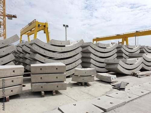 Precast concrete plant with blue sky in the construction site, in storage yard area at Thailand, Space for text in template, Concrete Tunnel Segments