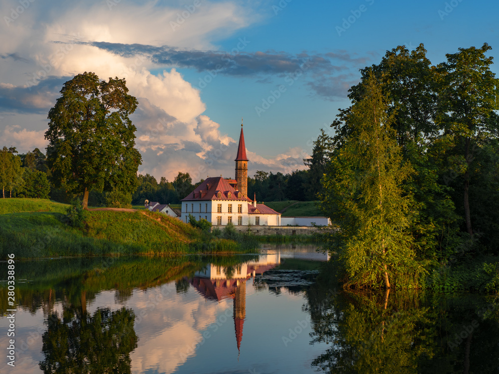 Evening summer landscape with a lake and a Palace. Gatchina