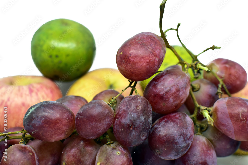 Closeup bunch of red grapes on white background Closeup bunch of red grapes on white background