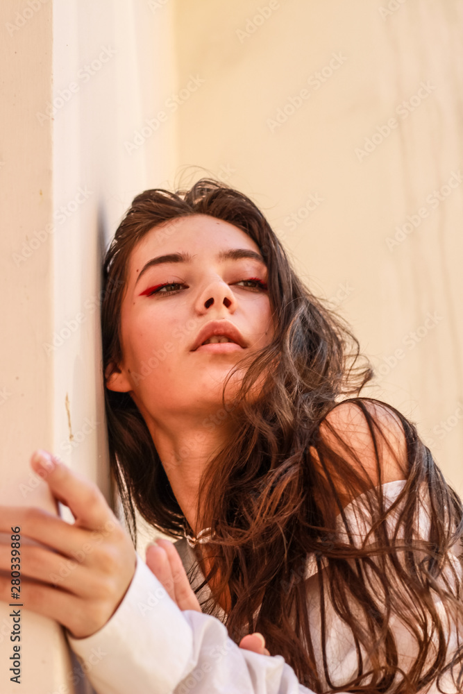 Young beautiful lady wearing a stylish white shirt.Portrait shooting of a stylish girl.Trends summer 2019. Young beautiful lady wearing a stylish white shirt.Portrait shooting of a stylish girl.Trends summer 2019.