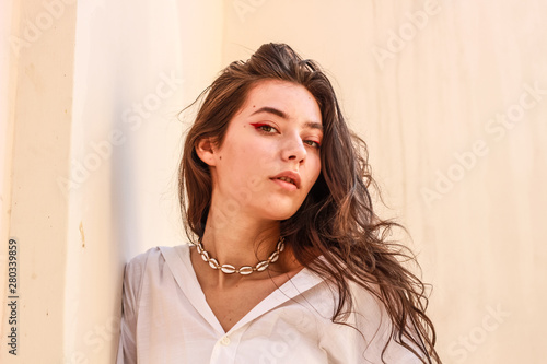 Young beautiful lady wearing a stylish white shirt.Portrait shooting of a stylish girl.Trends summer 2019. photo