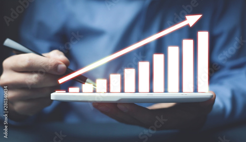 Graph on tablet. Concept of financial growth
