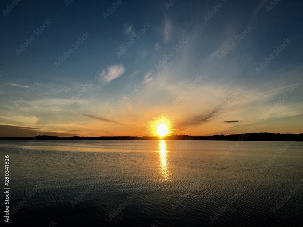 Dark Sunset at the lake in summer