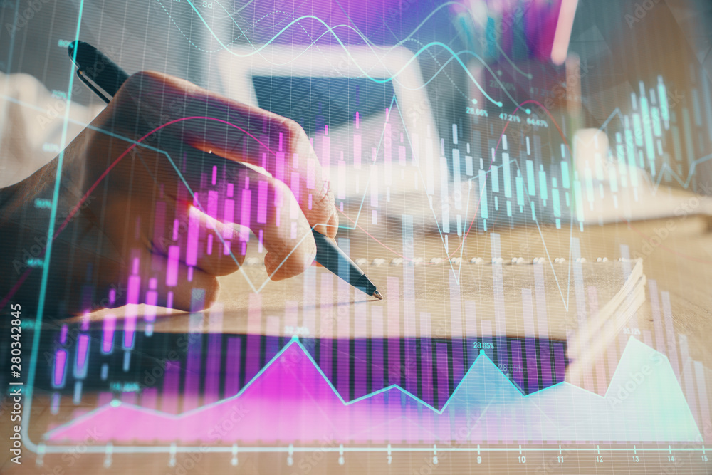Financial forex charts displayed on woman's hand taking notes background. Concept of research. Double exposure Financial forex charts displayed on woman's hand taking notes background. Concept of research. Double exposure