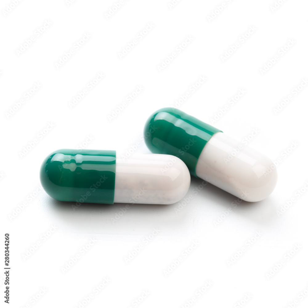 Capsule, pill on white background - isolated. Drug for health care. Biological food additives. Medical background for presentations and advertising of drugs Capsule, pill on white background - isolated. Drug for health care. Biological food additives. Medical background for presentations and advertising of drugs