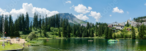 the picturesque Untersee lake in Arosa with the public swimming pool and a great mountain view