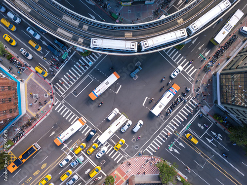 Aerial view of cars and trains with intersection or junction with traffic, Taipei Downtown, Taiwan. Financial district and business area in transportation smart urban city technology concept. photo