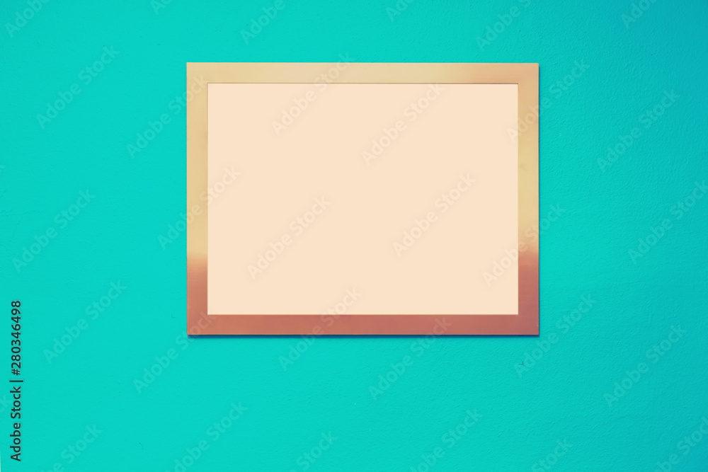 Empty picture frame on a bright solid background