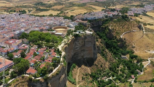 Aerial view of cityscape of Ronda, famous historic city and tourist attraction in Costa del Sol, corrida arena Bullring of the Royal Cavalry - landscape panorama of Andalusia from above, Spain, Europe