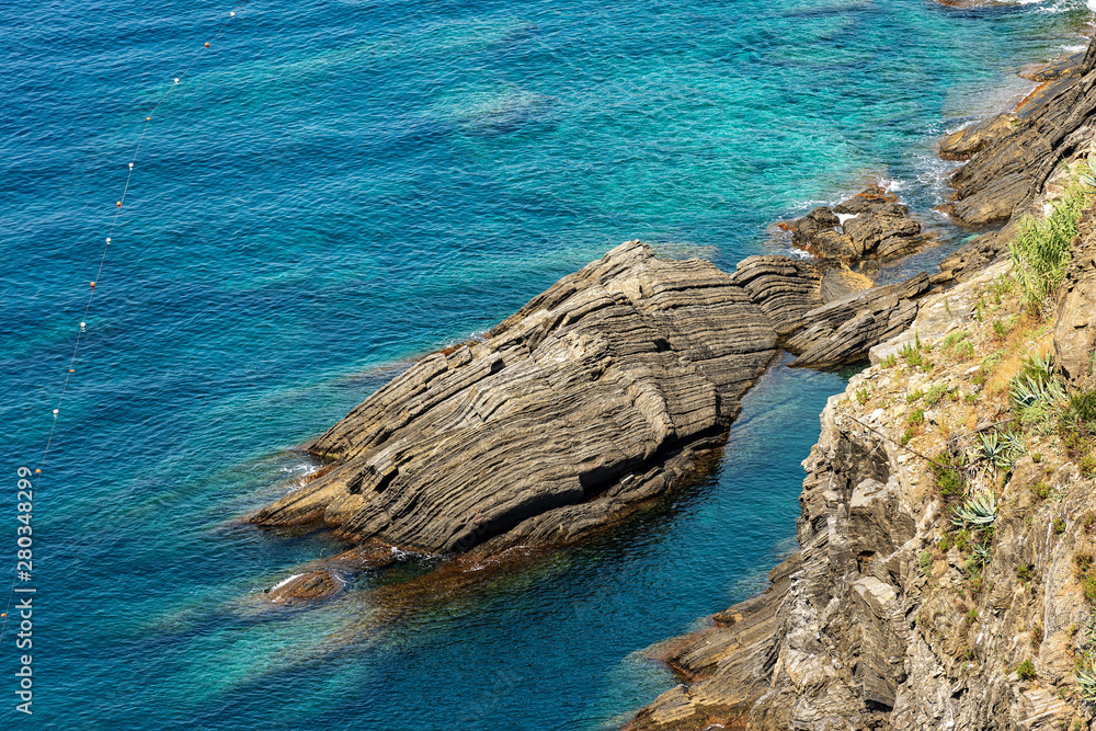Close-up of a cliff with the Mediterranean Sea, Cinque Terre National Park, UNESCO world heritage site. Vernazza, La Spezia, Liguria, Italy, Europe