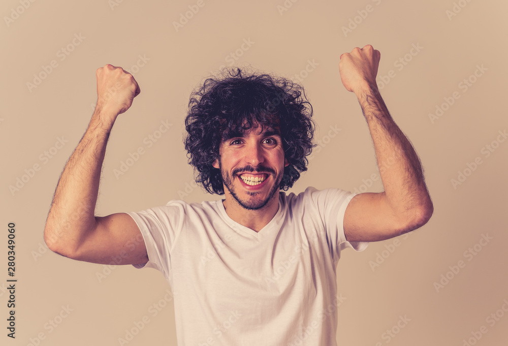 Portrait of surprised and happy man celebrating victory and winning lottery in human emotions Portrait of surprised and happy man celebrating victory and winning lottery in human emotions