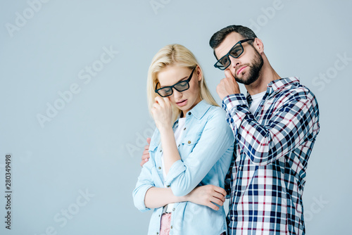 man and girl in 3d glasses wiping tears while watching movie isolated on grey