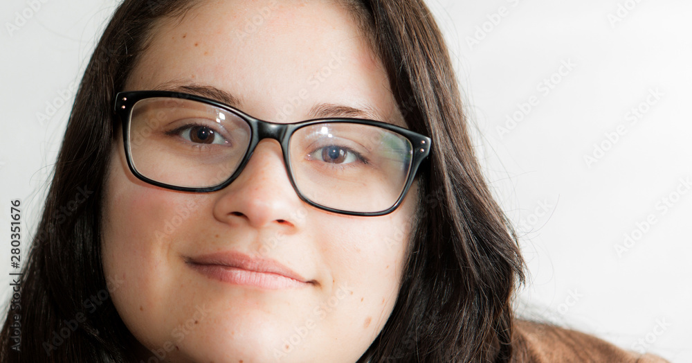 Young lady extreme closeup portrait. She is smiling to the camera. Young lady extreme closeup portrait. She is smiling to the camera.