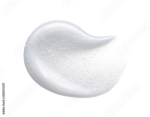 Pearly white smears and texture of face cream or acrylic paint isolated on white background photo