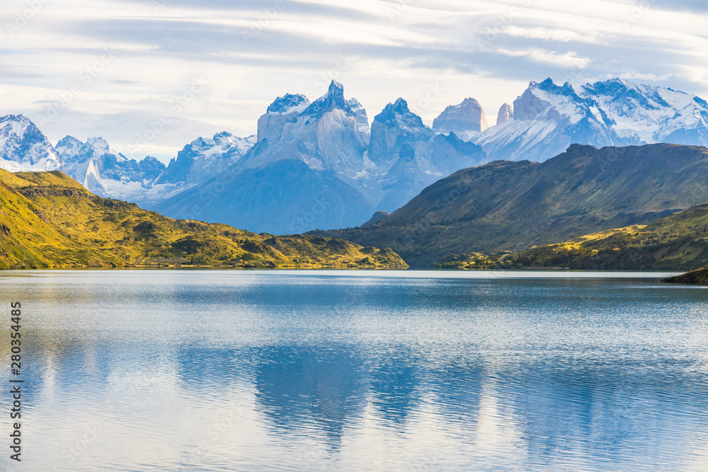 Beautiful panoramic view of lake with Cuernos, horn mountains peak with lenticular cloud in autumn, Torres del Paine national park, south Patagonia, Chile