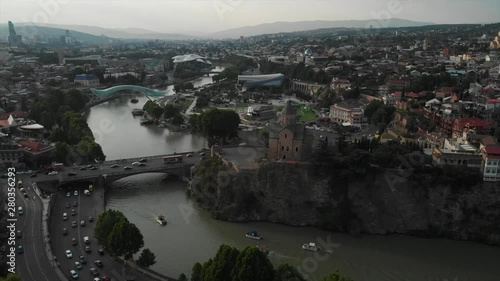 Aerial video of the Old Tbilisi center from above. Drone top view of historical part of city Dzveli Tbilisi. Kura or Mtkvari river below.