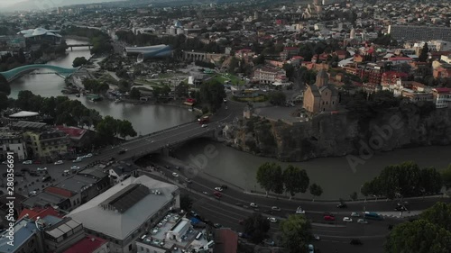 Aerial video of the Old Tbilisi center from above. Drone top view of historical part of city Dzveli Tbilisi. Kura or Mtkvari river below.