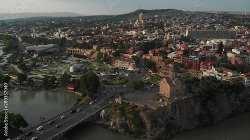 Aerial video of the Old Tbilisi center from above. Drone top view of historical part of city Dzveli Tbilisi. Kura or Mtkvari river below.