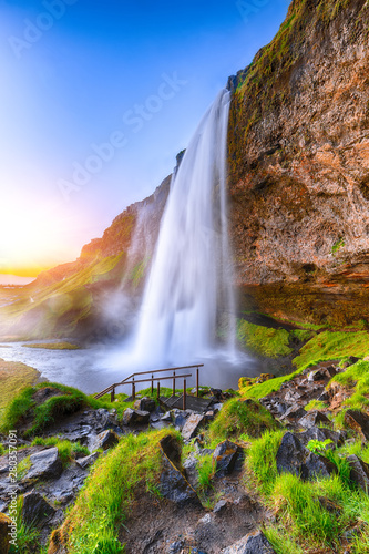 Beautiful Seljalandsfoss waterfall in Iceland during the sunset