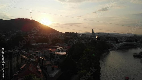 Aerial video of the Old Tbilisi center from above. Drone top view of historical part of city Dzveli Tbilisi. Kura or Mtkvari river below.