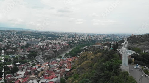 Aerial video of the Old Tbilisi center from above. Drone top view of historical part of city Dzveli Tbilisi. Kura or Mtkvari river below.