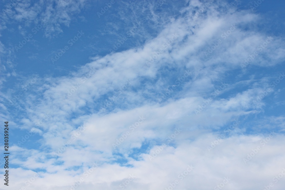 Beautiful clouds floating on the vast blue of the sky Beautiful clouds floating on the vast blue of the sky