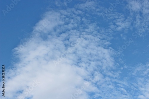 Beautiful clouds floating on the vast blue of the sky