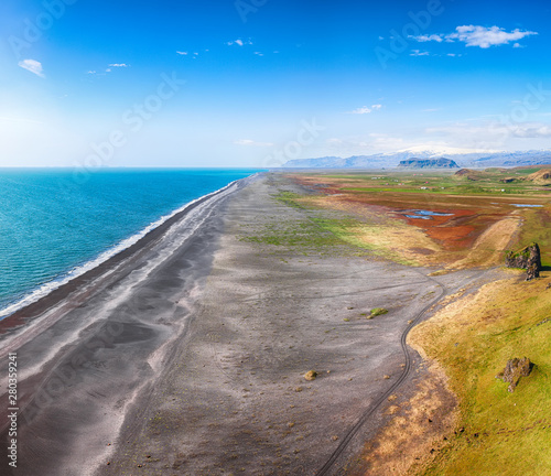 View of Kirkjufjara black sand beach from Dyrholaey promontory
