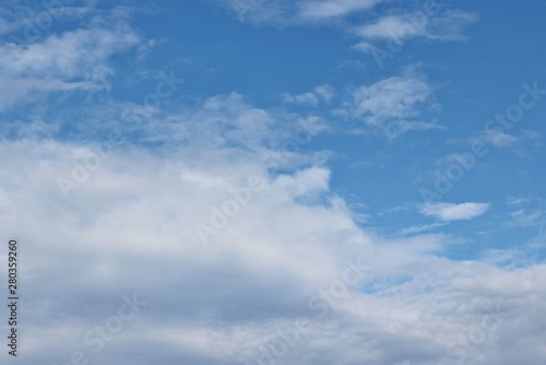 Beautiful clouds floating on the vast blue of the sky