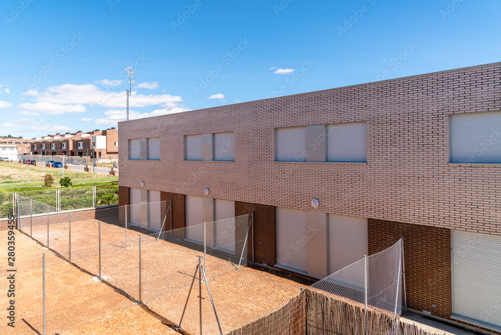 Exterior view of modern townhouses with brick facade